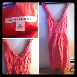 Coral color dress. The straps cross in the back