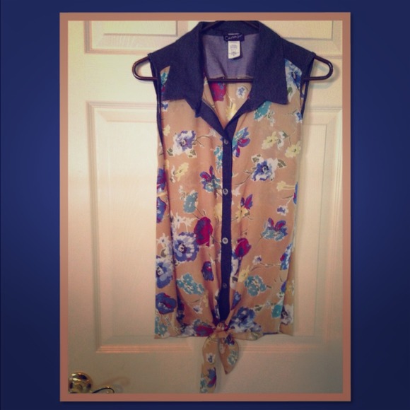 Cute, sheer sleeveless blouse.