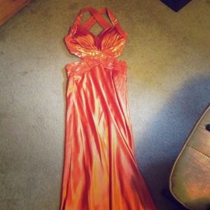 Burnt orange floor length dress, very formal.