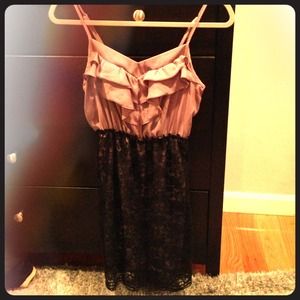 Adorable ruffled top dress with lace skirt.