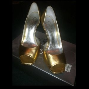 Gold open toe Jessica Simpson heels .