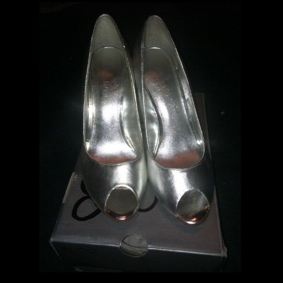 Silver open toe Aldo shoes.