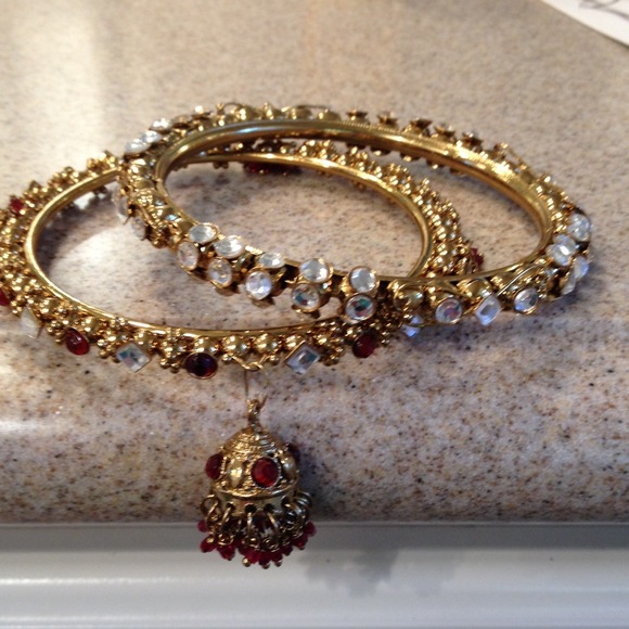 Gorgeous bangles. Gold and white and red stones.