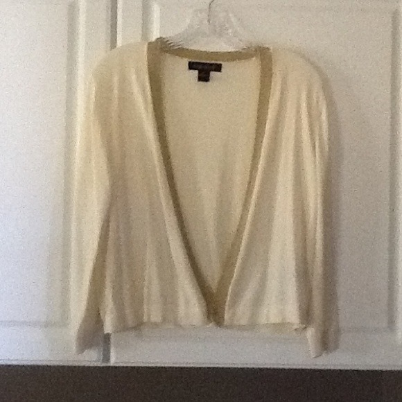 Cream colored sweater with gold trim