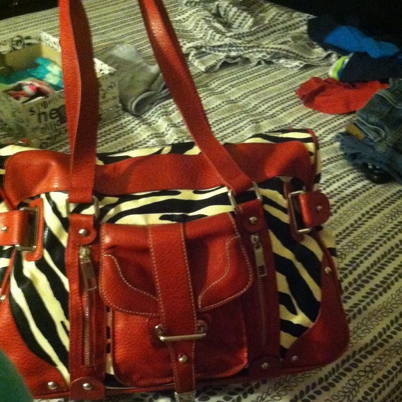100% leather Zebra print/red purse
