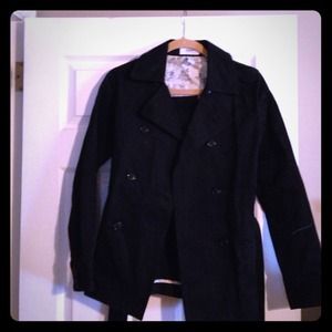 Below the waste trench coat with belt