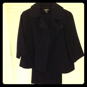 Navy pinstripe suit with short jacket; modern fit