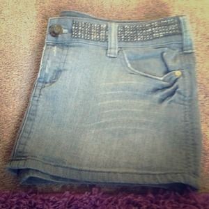 Grey denim skirt, with studs.