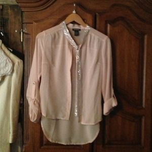 Light pink sheer shirt with silver embellishments.