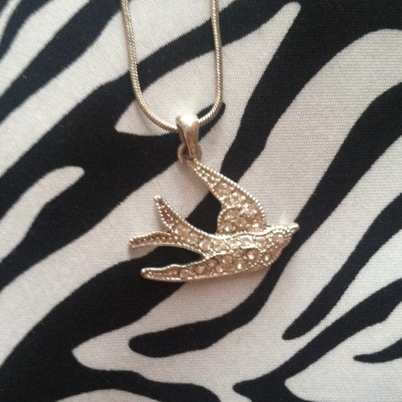 Diamond bird necklace .