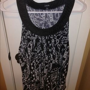 Black and white sleeveless top.
