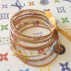 Bundle of 8 bangles. Gold/rose gold w red beads