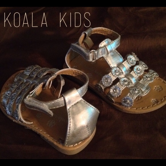 Toddler girl's metallic silver open-toed sandals.