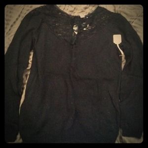 NWT. Black sweater with lace neckline.