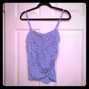 Light blue top with decorative flowers.