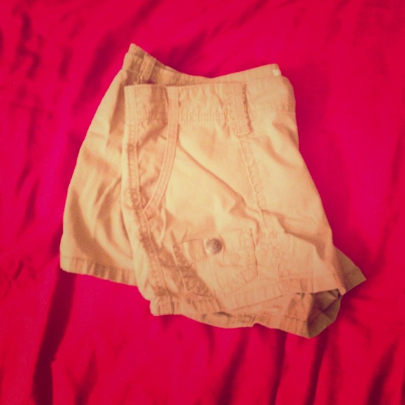 Selena Gomez tan shorts.