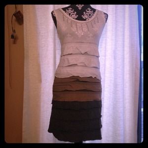 White, brown, and dark gray ruffle dress.