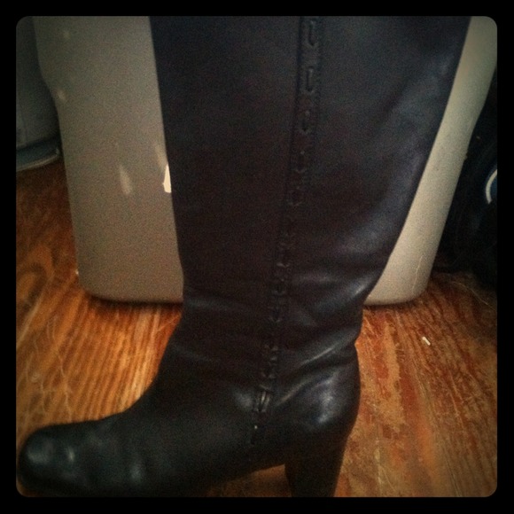 Tall black boots.