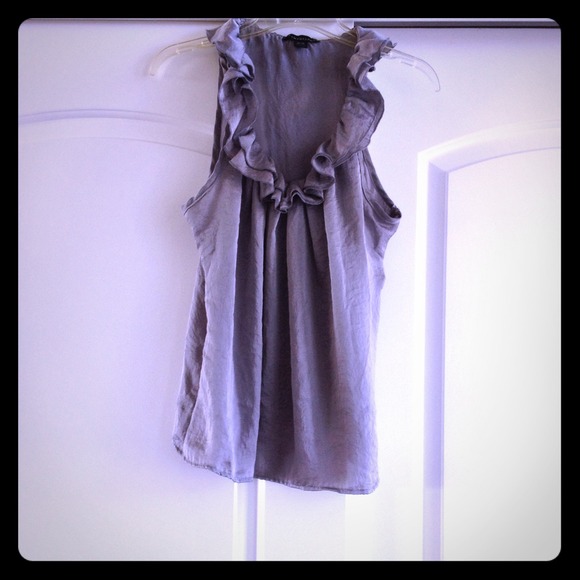 Silver ruffled tank.