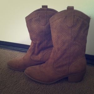 Brown suede slouch cowgirl boots.