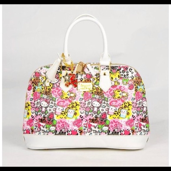 Hello kitty tote purse with key chains.