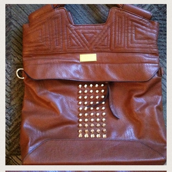 Large cross body purse or shoulder purse.