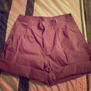 High waisted pleated front roll cuff shorts.