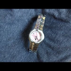 Tag Heuer watch, silver with pink face.