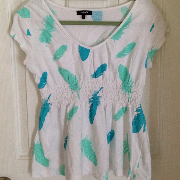 White baby doll with feather design