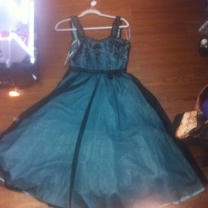 Formal teal dress by De Laru