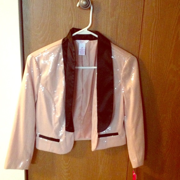 Candies light pink with black trim blazer.