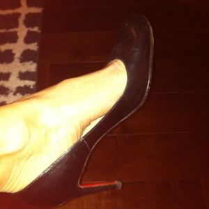 Christian Louboutin black leather pumps