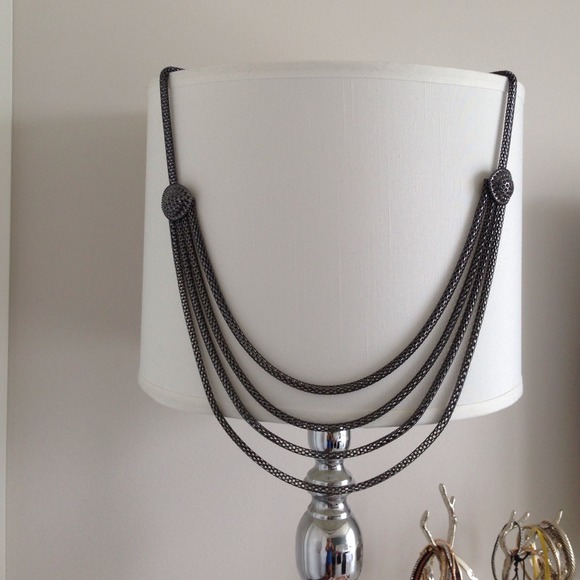Long silver mesh necklace.