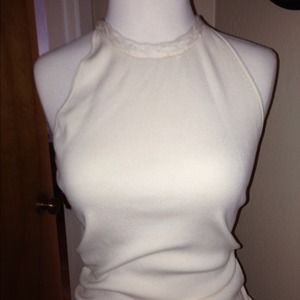 Silk  blend sweater with with peephole tie.