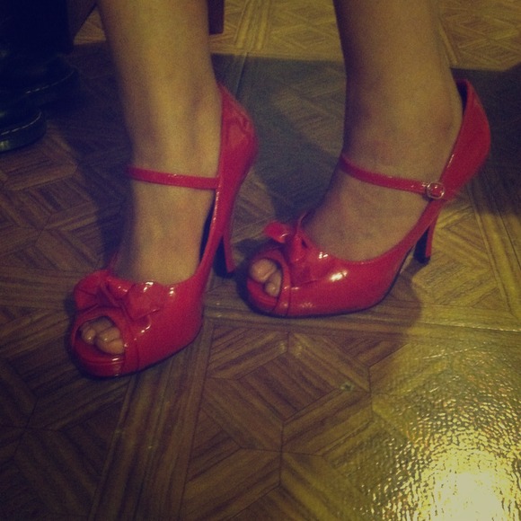 Red patent leather pin up couture peep-toe heels.