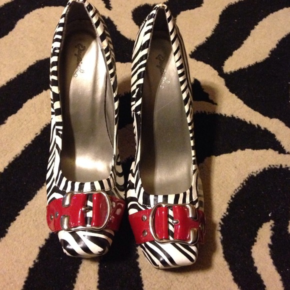 Zebra print heels with red strap and buckle