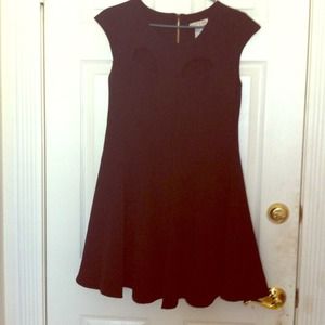 Little black dress with cutout details in bust.