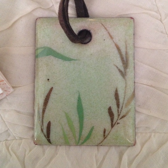 Enamel pendant on leather cord