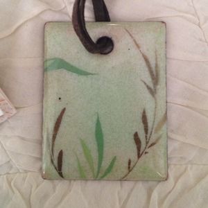 Enamel pendant on leather cord