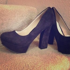 Black suede platform heel.