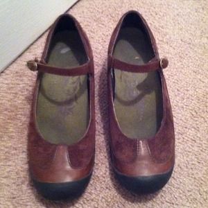 Brown Merrell Performance Footwear.
