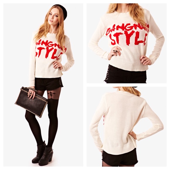 Cream sweater with large red gangham style logo.