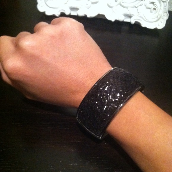Metal cuff with black glitter.