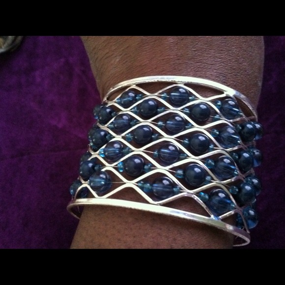 Silver and green beaded cuff bracelet.