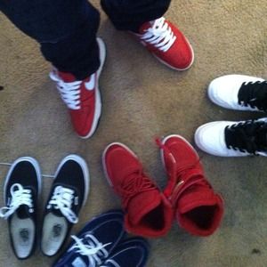 White/Red low-top nike shoes .