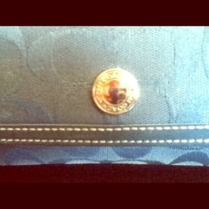 Coach wallet . Worn . I've loved this wallet
