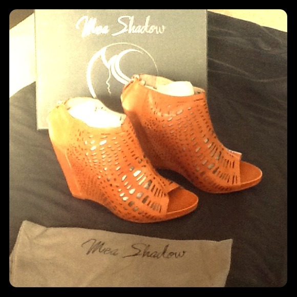 Adorable Leather Wedges.