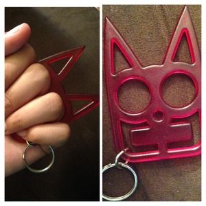 "Brass knuckles" like protective key chain