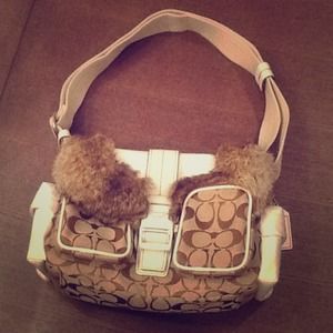 Genuine rabbit fur trim coach bag.