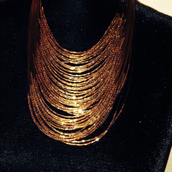 Brown, yellow and gold necklace.